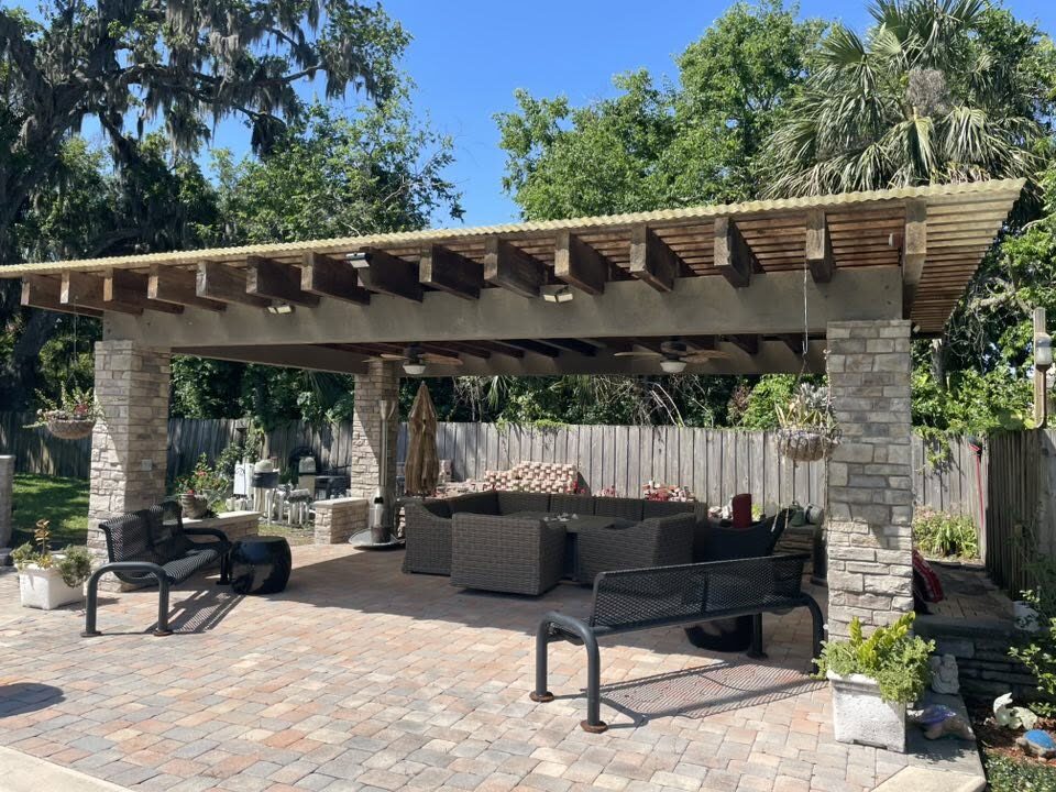 Outdoor kitchen pavilion with concrete floor